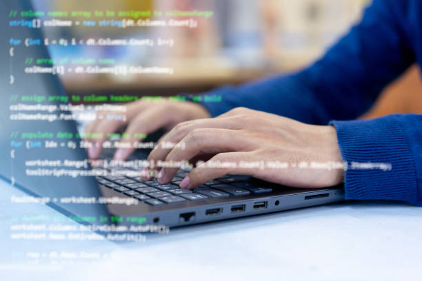 close up programmer man hand typing on keyboard at laptop  to input code language into software for study bug and defect of system at office for  development of technology concept